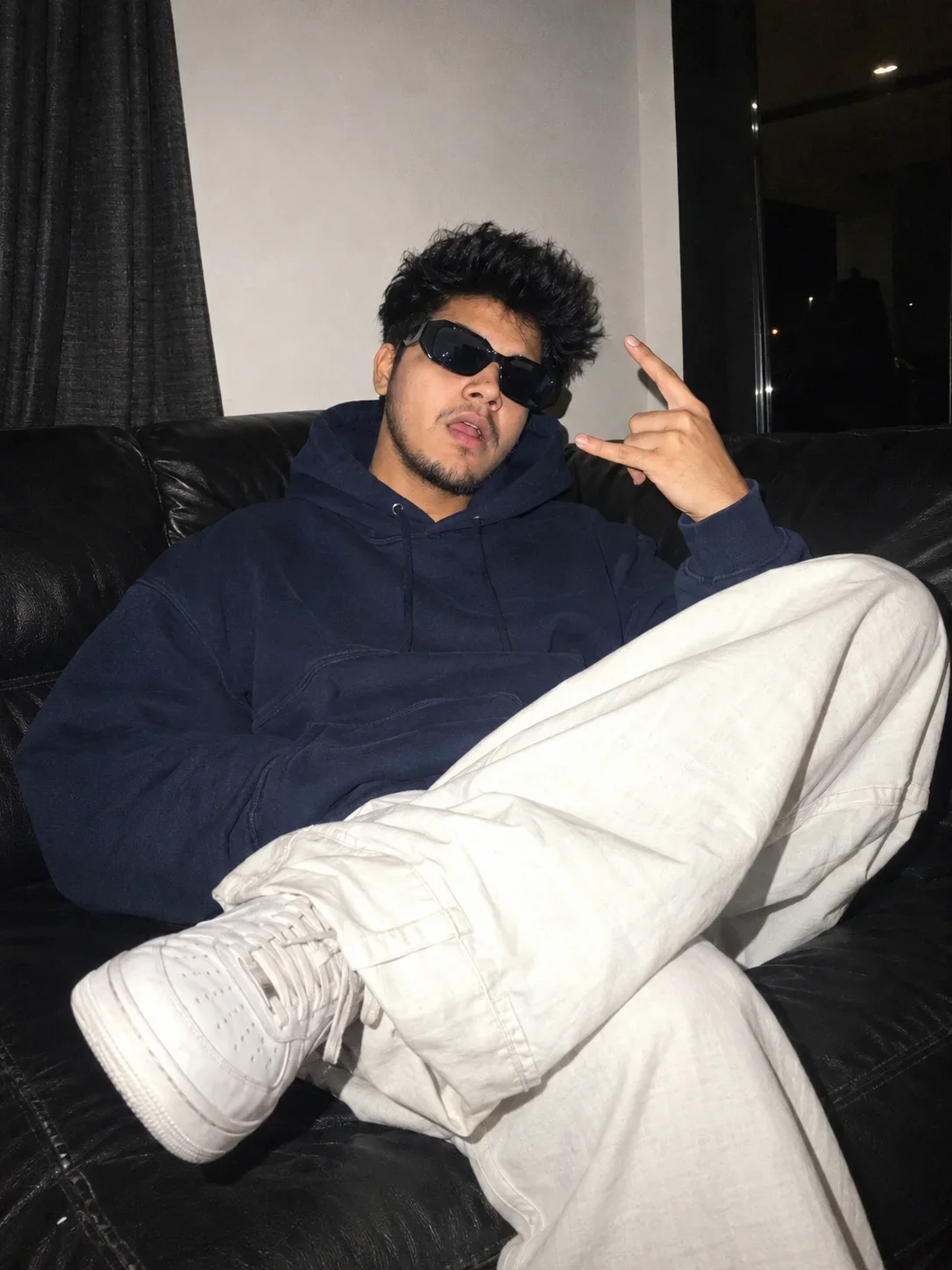 Boy Image Prompt: Y2K Streetwear Portrait on a Black Leather Couch
